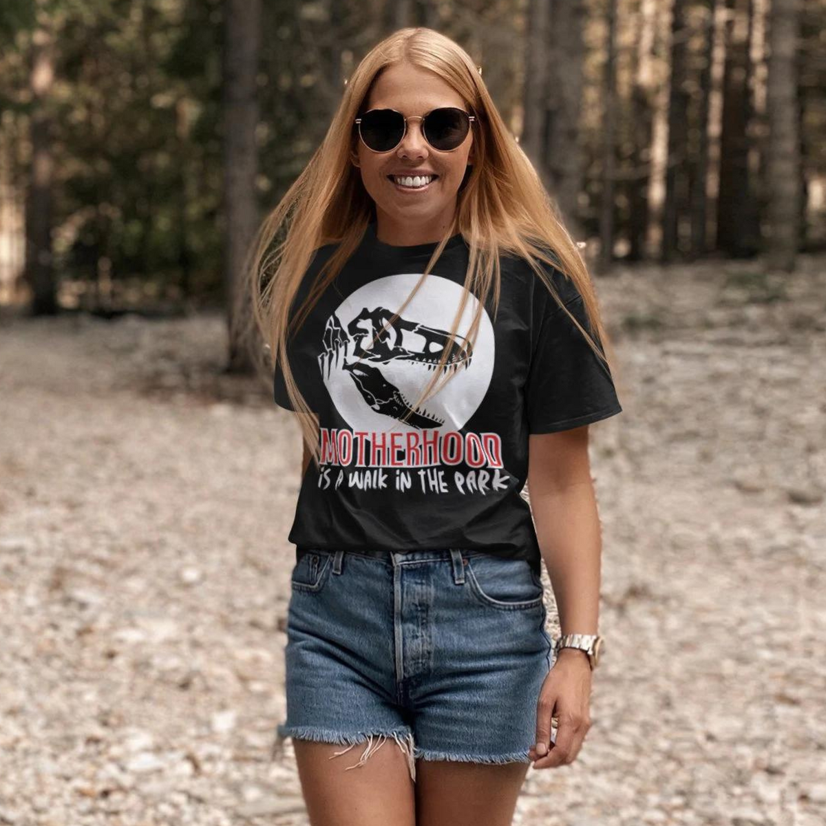 t-shirt, dinosaur, motherhood, parenting, family, mom life, comfortable, graphic design, mother's day, gift for mom, soft fabric, empowering phrase, casual style, strength, adventure, mom pride, chic, quality, lasting impression, cute design, love, grace, fashion, motherhood is a walk in the park tee