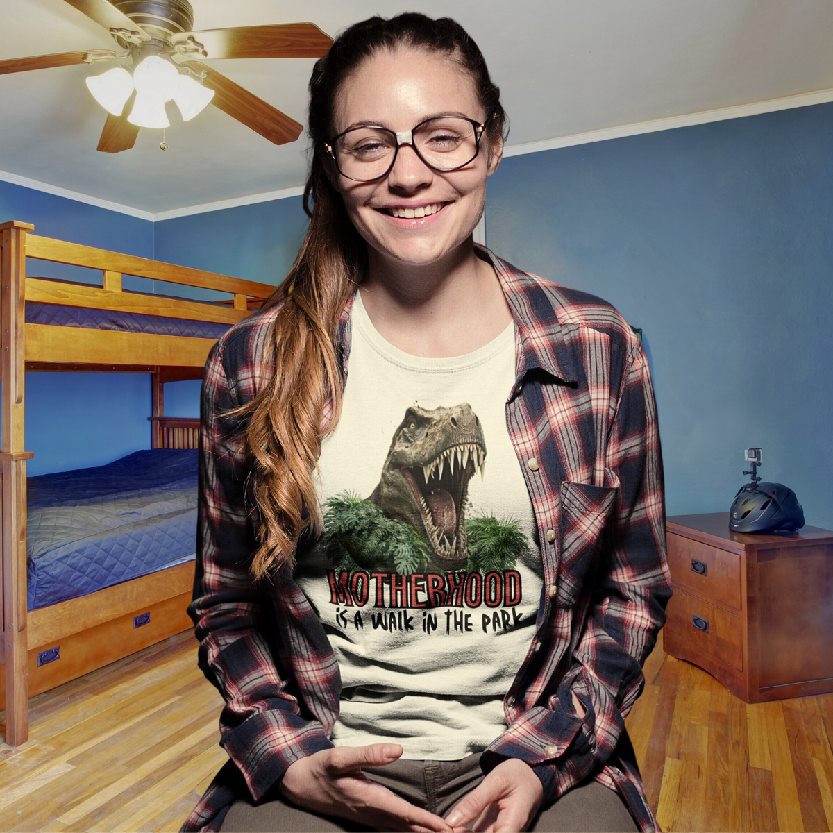 t-shirt, dinosaur, motherhood, parenting, family, mom life, comfortable, graphic design, mother's day, gift for mom, soft fabric, empowering phrase, casual style, strength, adventure, mom pride, chic, quality, lasting impression, cute design, love, grace, fashion, motherhood is a walk in the park tee