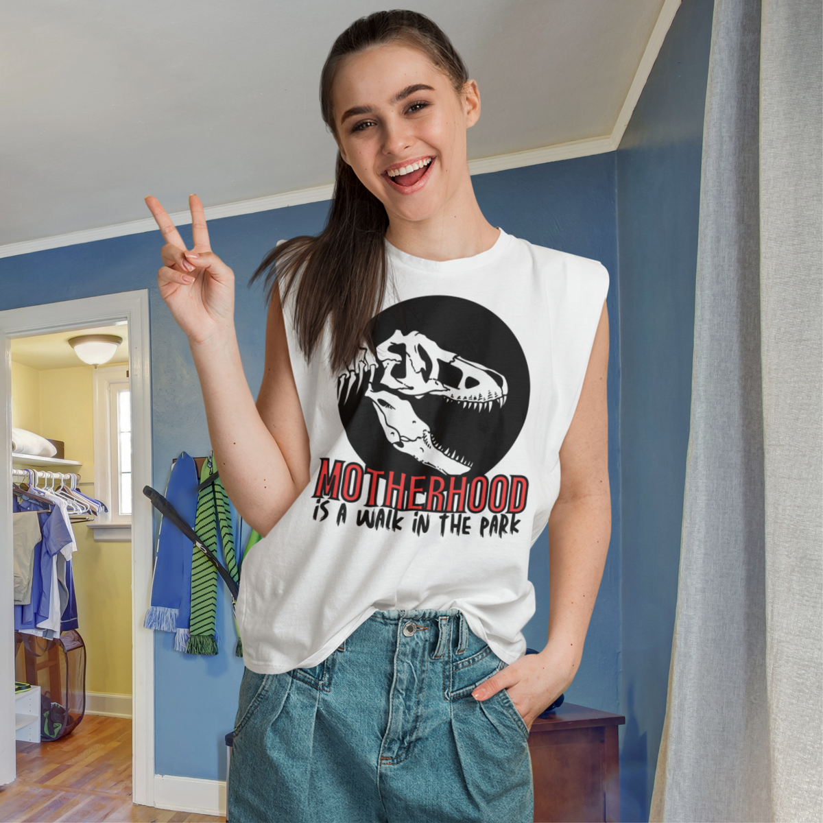 muscle shirt, dinosaur, motherhood, parenting, family, mom life, sleeveless tee, graphic design, mother's day, mom gift, comfortable, empowering phrase, casual wear, strength, adventure, mom pride, chic, soft fabric, unique design, confidence, love, grace, fashionable, motherhood is a walk in the park tee