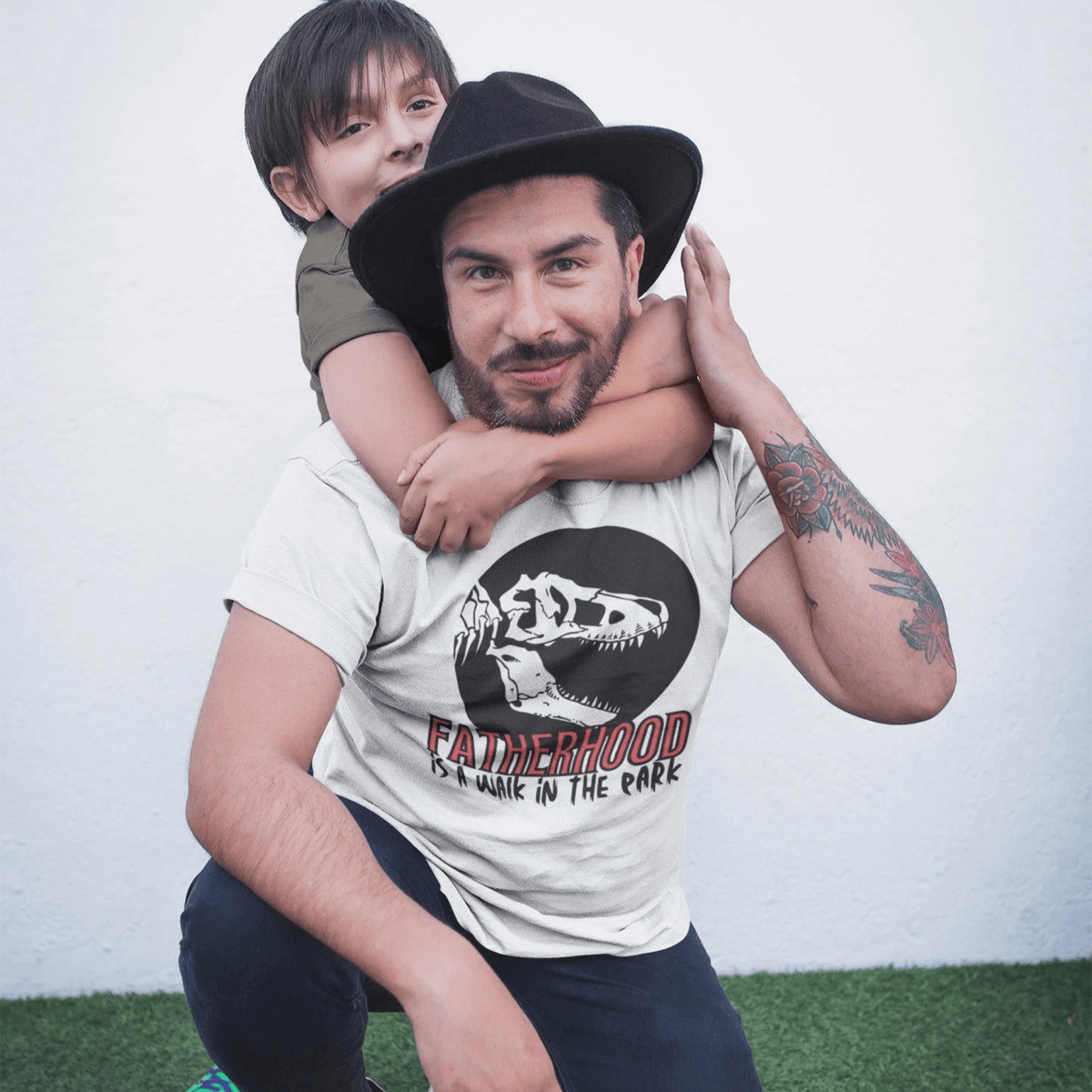 dinosaur, fatherhood, parenting, family, dad life, t-shirt, casual wear, graphic tee, father's day, gift for dad, comfortable, playful design, soft fabric, unique phrase, conversation starter, prehistoric, adventure, dad pride, comfort, stylish, fun, dad fashion, fatherhood is a walk in the park tee