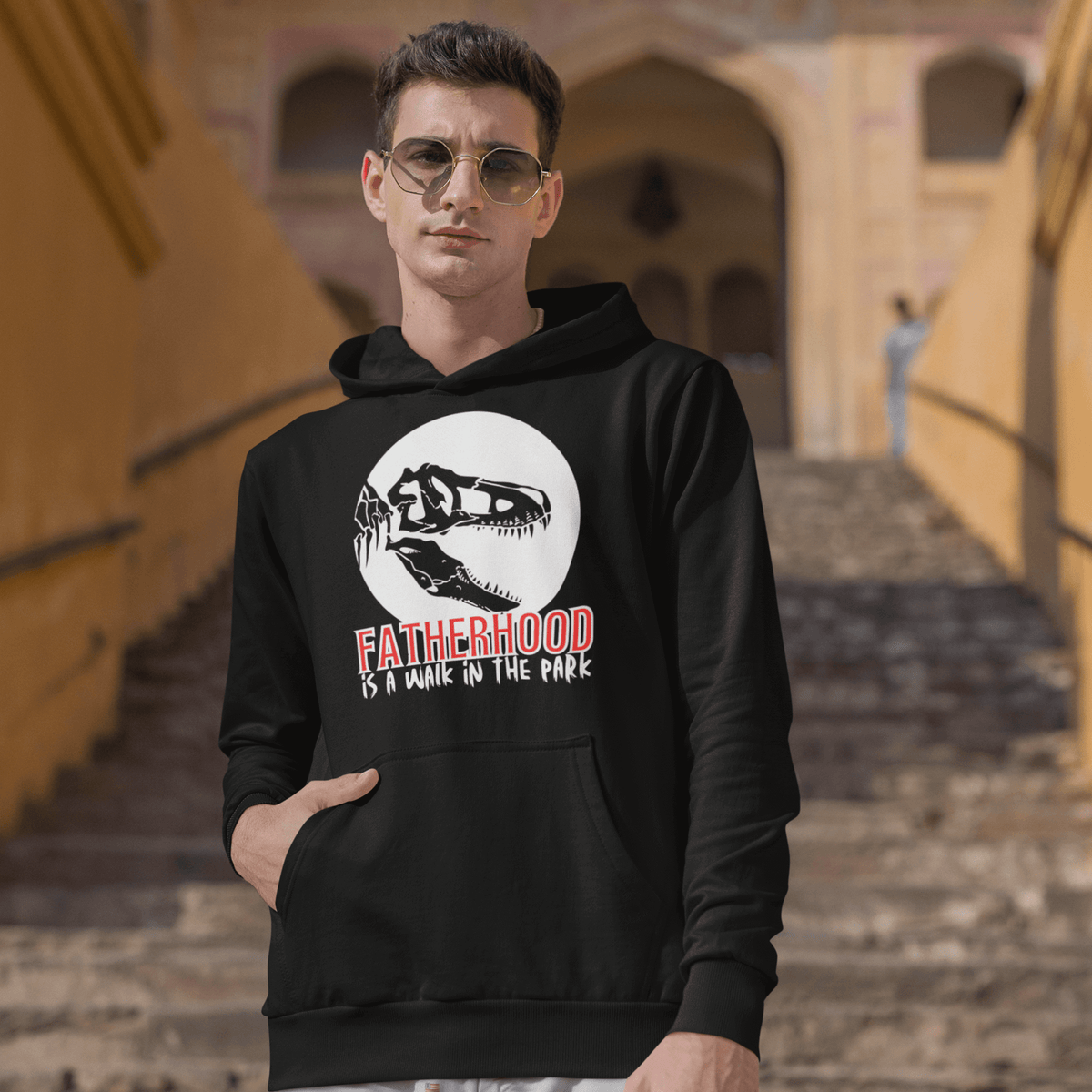 hoodie, dinosaur, fatherhood, parenting, family, dad life, cozy wear, graphic design, father's day, gift for dad, comfortable, unique phrase, casual style, warmth, versatile, soft fabric, empowerment, adventure, dad pride, loungewear, fashionable, quality, durability, fatherhood is a walk in the park tee